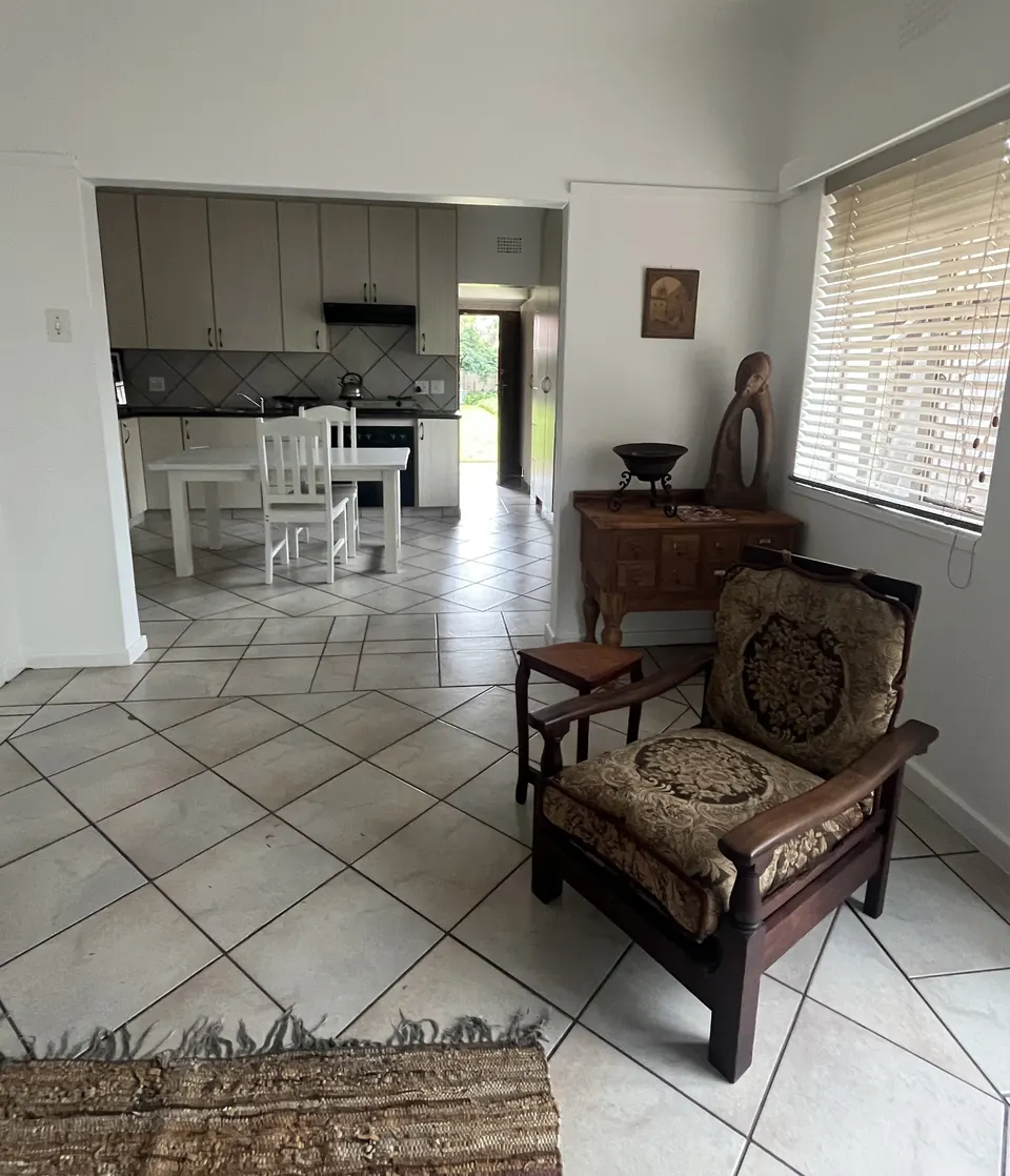 Antique armchair and carved sculpture in the two-bedroom unit